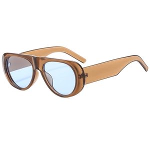 Fashionable oval sunglasses with brown frames and blue lenses in a 45-degree side view