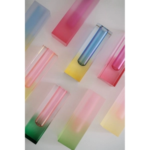 Modern minimalist acrylic vases with colorful gradients on white background
