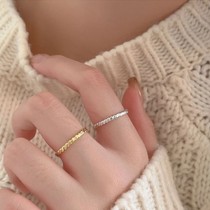 Minimalist S925 sterling silver braided twist rings in gold and silver set on hands