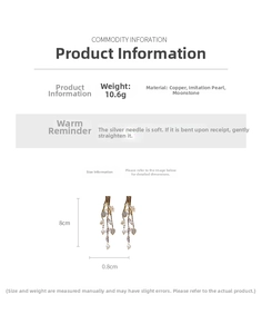 Detail view of silver needle flower tassel earrings with pearls and moonstone accents