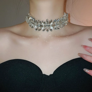 Detailed view of silver choker featuring sparkling flower-shaped teardrop crystals on neck