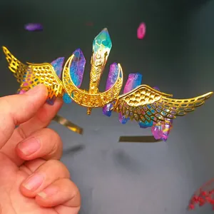 Macro detail of golden wing wings and gradient blue crystal pillars on fantasy crown