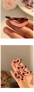 Detail of pink heart hair clips set showing resin texture and metal back on hand