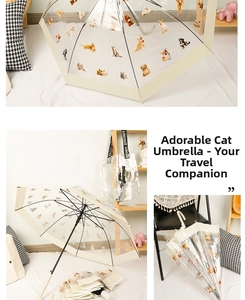 Detail of transparent umbrella featuring cute cat and dog prints with cream handle