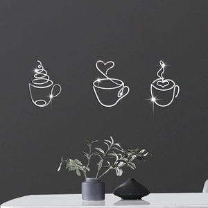 Minimalist silver coffee cup wall art set with heart and steam lines on grey wall