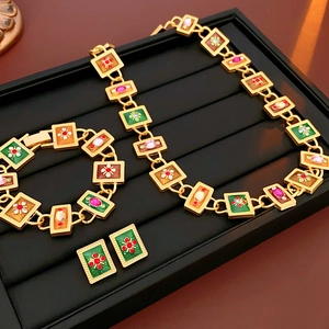 Detailed set of vintage enamel flower jewelry with necklace, bracelet and earrings