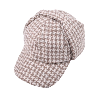 Close-up of winter houndstooth earflap baseball cap with warm wool blend fabric