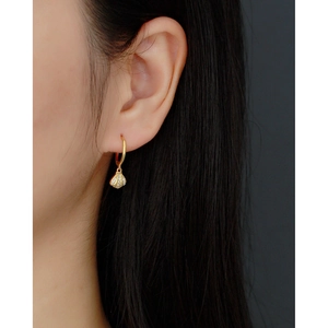 S925 sterling silver gold shell earrings with pavé crystals on elegant female model