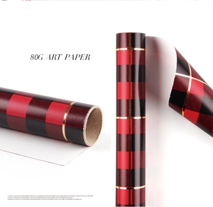 Detail of 80g art paper with classic red and black buffalo plaid pattern and gold lines