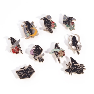 Gothic enamel pin set with raven, moon and wizard hat designs on white background