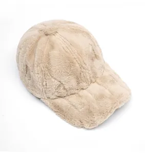 Top view of beige faux rabbit fur baseball cap showing thick plush texture and warm material
