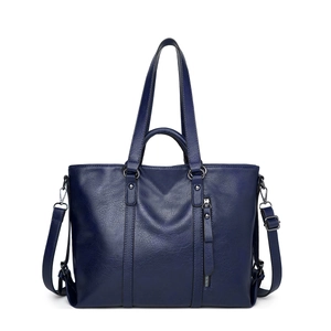 Detail of navy blue PU leather tote bag featuring sturdy handles and metal zipper accents