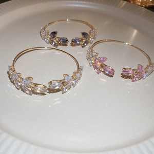 Elegant crystal leaf open bangles in gold-plated alloy, showing multiple color options