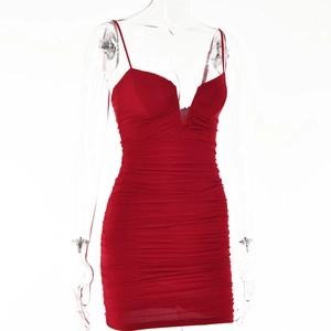 Detail of red sexy V-neck backless mini dress with elegant ruched fabric on a mannequin