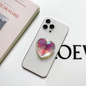 Detail shot of heart-shaped holographic phone grip with geometric faceted design