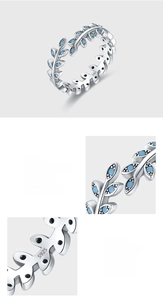 Macro detail of S925 sterling silver ring showing pave setting turquoise leaf and hallmark