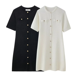 Short sleeve knit dress with gold buttons in black and white available in vertical textures