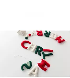Detailed view of handmade wool felt Merry Christmas letters and ornaments