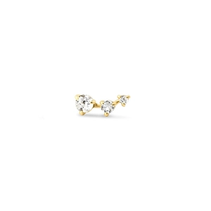 Detail of three-stone gold ear climber with sparkling white zircons in a linear claw setting