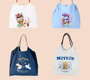 Detail view of cartoon animal embroidery designs on nylon drawstring tote bags