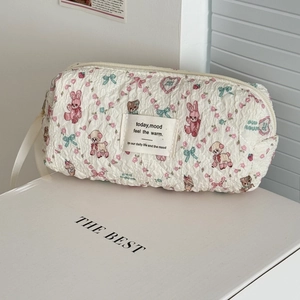 Quilted floral makeup bag with cute cartoon animal patterns and a side handle strap