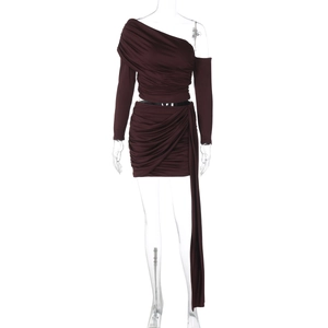 Detail of dark brown off-shoulder ruched top and matching skirt with long ribbon streamer