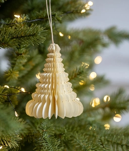 Detailed view of cream-colored paper honeycomb Christmas tree ornament with fine cotton string