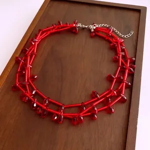 Double-layered red glass beaded necklace with faceted diamonds and silver adjustable clasp