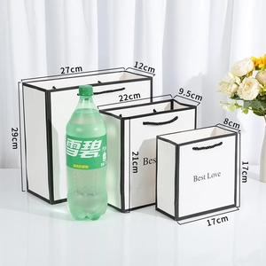 Minimalist white gift bags with black cord handles and Best Love text in three sizes