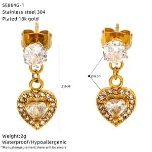 Detail view of 18K gold plated heart earrings with zircon inlay and product specifications