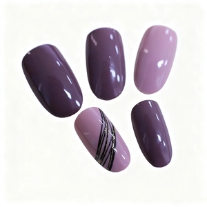 Detail of oval press-on nails in purple and pink with hand-painted gold line art decoration