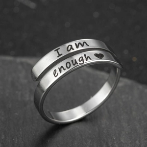 Adjustable silver stainless steel ring engraved with I am enough and heart on dark stone
