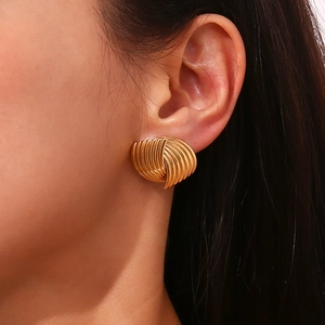 Chic 18K gold plated stainless steel fan striped cross earrings worn by a model