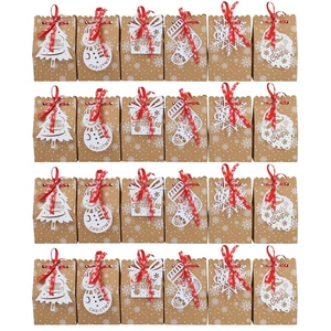 Set of 24 Christmas kraft paper gift bags with red ribbons and festive laser-cut tags