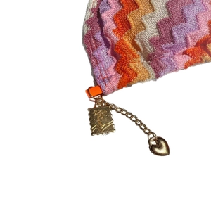 Striped gradient bikini with zigzag knit pattern and gold palm tree heart pendant detail