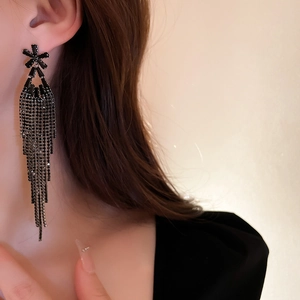 Elegant vintage black crystal flower long tassel earrings for women on a model