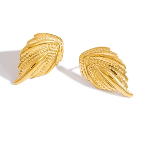 Detailed view of 18K gold leaf earrings with intricate feathered textures and glossy finish