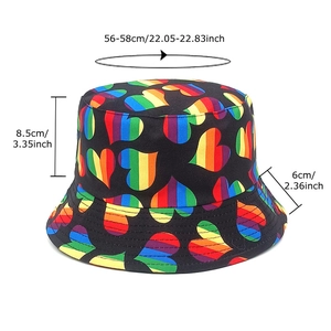 Reversible black bucket hat with rainbow heart pattern featuring 56-58cm head size