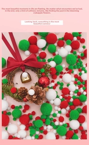 Detail of DIY Christmas pompoms with a pinecone wreath and gold bells decoration