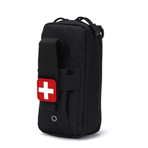 Close-up of tactical nylon medical pouch with red cross patch and MOLLE webbing system