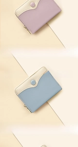Macro view of bicolour zipper purse showing soft leather texture and card slots