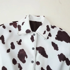 Women's casual button-down jacket featuring brown cow animal print and textured fabric