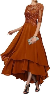 Detail of caramel lace bodice with floral embroidery and layered chiffon evening gown