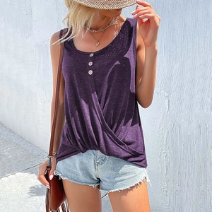 Detail view of deep purple sleeveless top with button accents and twisted hem design