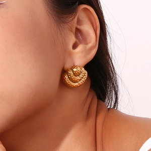 Three-layer hammered texture fan earrings in 18K gold plated stainless steel on model