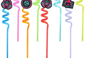 Detailed view of colorful reusable spiral straws with musical party theme decorations