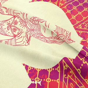 Close-up of ethnic goddess mandala tapestry showing fine fabric texture and golden prints