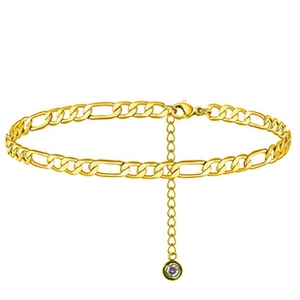 Detail of gold Figaro chain anklet featuring a clear round cubic zirconia charm