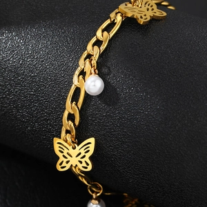 Golden Cuban chain bracelet with butterfly charm and white pearls for women's fashion