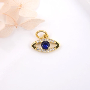Golden Evil Eye charm with blue sapphire-style stone and micro-pave cubic zirconia